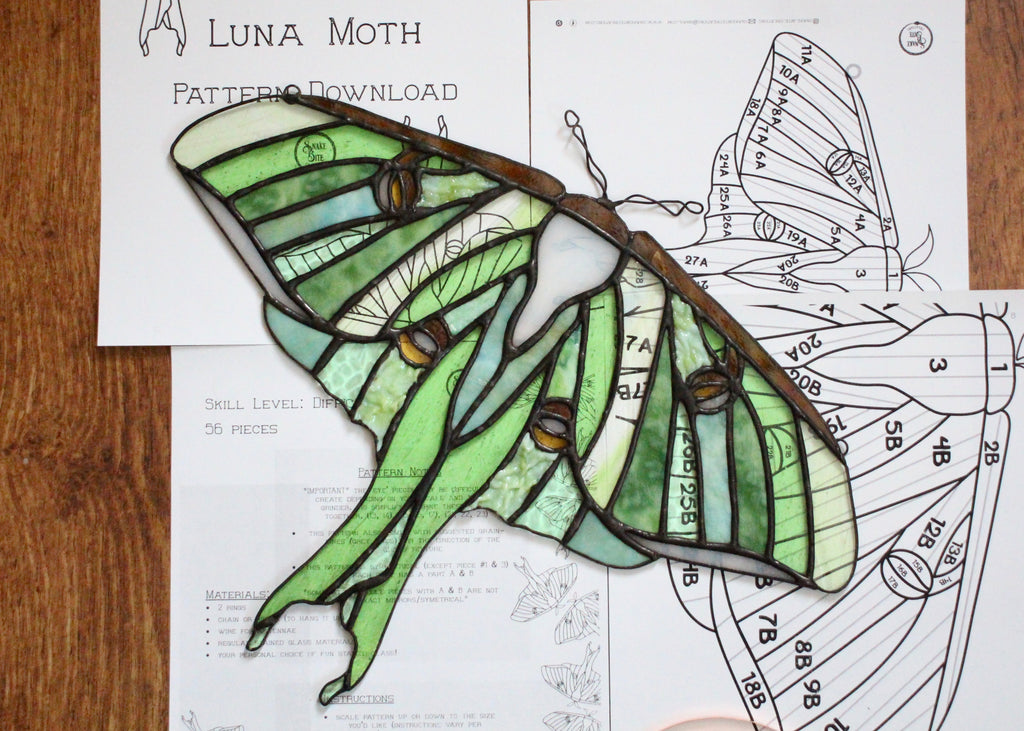 luna moth; green moth with brown accents made in stained glass on printed paper patterns